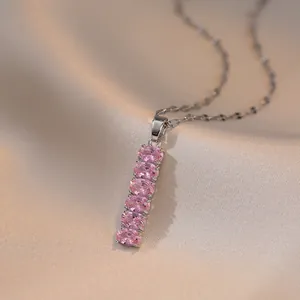 Pink zircon bamboo-style pendant necklace with polished silver steel chain on silk