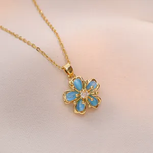 Elegant gold titanium steel necklace with a blue cat-eye stone flower rotating pendant