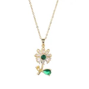 Detail of spinning sunflower necklace with emerald center and baguette zircon petals