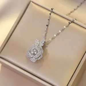 Sparkling silver rose pendant necklace with white zircon on champagne silk jewelry box