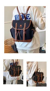 Close-up of contrast color backpack with tulip embroidery and premium leather details