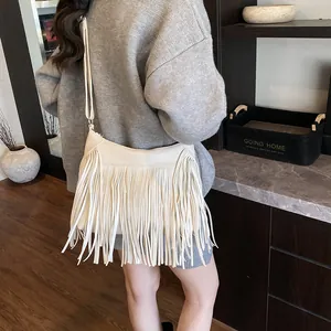 Retro bohemian cream fringe hobo bag with adjustable strap for stylish women