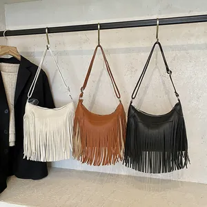 Retro tassel hobo shoulder bags in beige, brown, and black colors with lychee texture