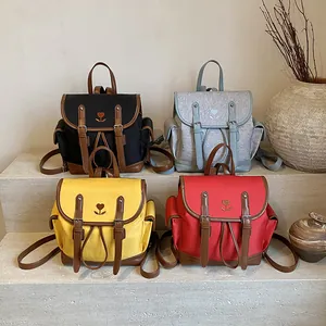 Minimalist aesthetic school backpack with tulip embroidery in four vibrant colors