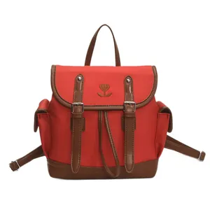 Sac à dos rétro en toile rouge et marron avec broderie cœur et détails en cuir