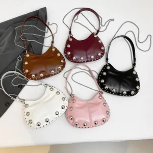 Minimalist studded dumpling bags in five colors with leather handles and metal chains