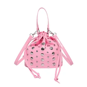 Pink bucket bag with silver studs and drawstring closure, stylish women's crossbody purse