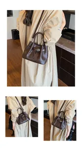 Close-up of dark brown woven texture with silver buckle on a stylish tote bag