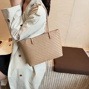 Minimalist light brown woven tote bag for women featuring premium braided texture style