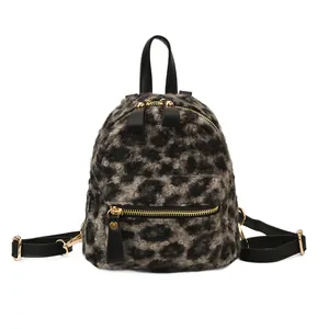 Mini leopard print backpack in plush faux fur with black leather straps and gold hardware