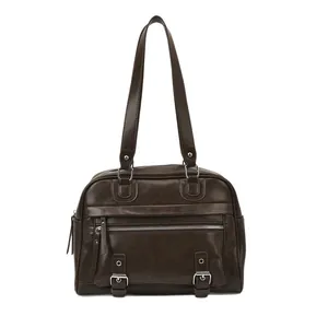 Retro dark brown pillow bag with silver hardware and front zipper on white background