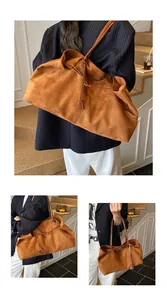 Detail shot of caramel suede tote bag with drawstring design and long shoulder straps