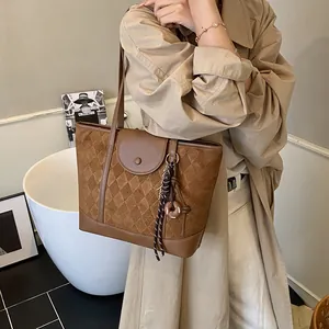 Brown quilted suede tote bag with stylish plaid stitching for professional women