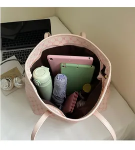 Detail view of pink tote bag spacious interior storage for tablets and daily items
