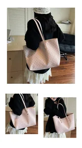 Close-up of pink tote bag with geometric pattern and slim leather straps for daily use