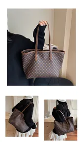 Detailed view of vintage large tote bag featuring brown geometric chain patterns and strap