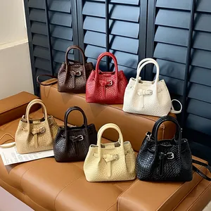 Minimalist woven tote handbag for women in various colors with adjustable shoulder straps