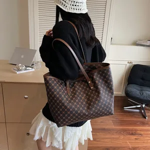 Classic vintage patterned tote bag with brown leather straps for elegant daily commute