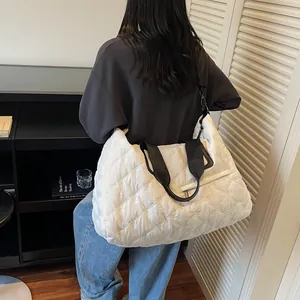 Quilted white puffer tote bag with black straps and spacious compartment for daily sport