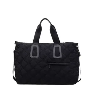 Large black quilted gym bag with floral embroidery and detachable shoulder strap