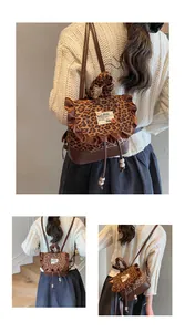Detail view of leopard print backpack featuring brown ruffles and drawstring closure design