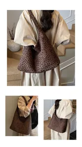 Detailed view of the leopard print canvas tote bag with a wide shoulder strap in hobo style