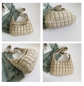 Detailed views showing the texture and strap of a beige quilted puffer crossbody bag
