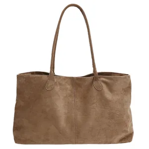 Large capacity tan faux suede tote bag with minimalist stitching and dual shoulder straps