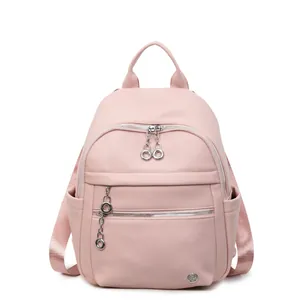 Pink lychee grain faux leather backpack for women with silver ring zippers and straps