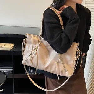 Beige vintage chain tote bag with tassel detail and woven side stitching for women