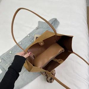 Brown vintage suede tote bag with large capacity and inner zip compartment shown from above