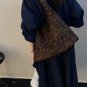 Large capacity leopard print tote bag with soft fabric worn by model for daily wear