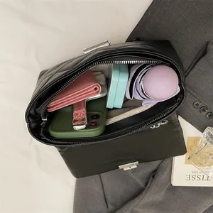 Quilted black leather crossbody bag with spacious interior for wallet, phone and umbrella