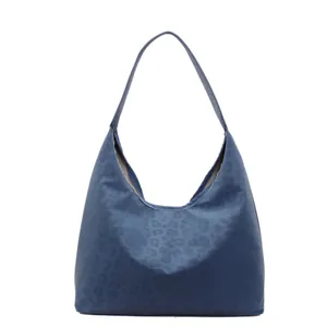 Navy blue leopard print hobo shoulder bag with matte finish and spacious interior