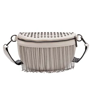 Chic beige half-moon chest bag with metal studs, chain tassels and woven shoulder strap