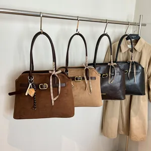 Large suede tote bags with belt buckles and ribbon details for office commute