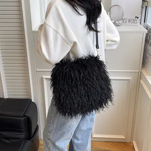 Women's black fluffy faux fur crossbody bag with adjustable leather strap and gold hooks