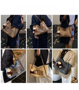 Detailed view of spacious tote bags in four colors with retro MCAORI lettering and teddy charm