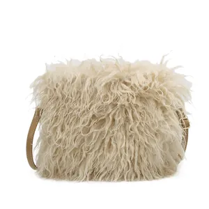 Plush faux fur crossbody bag with adjustable brown leather strap in cream white