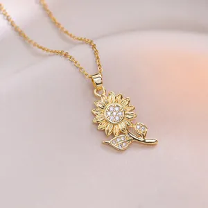 Exquisite gold sunflower pendant necklace with zircon flower petals on soft champagne fabric