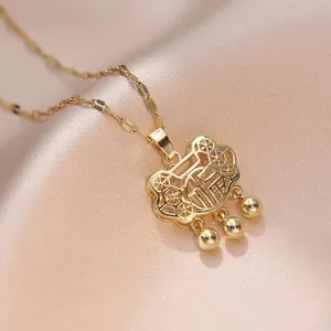 Golden Ruyi Lock necklace with Fu character pendant on elegant champagne silk fabric