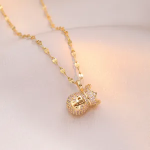 Elegant gold money bag pendant necklace with sparkling micro-pave crystals on silk