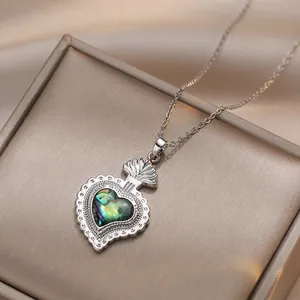 Abalone heart pendant necklace with shimmering zircon and silver steel chain detail