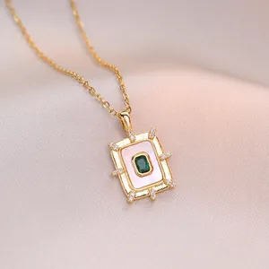 Elegant emerald green zircon necklace in rectangular gold plating on champagne silk