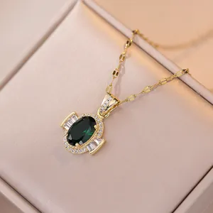 Elegant gold emerald zircon pendant necklace set in champagne velvet jewelry box display