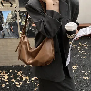 Chic brown leather hobo bag with pleated texture for urban casual shoulder wear