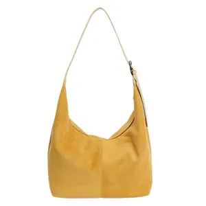 Sac hobo en daim jaune avec bandoulière réglable et grand volume en forme de croissant