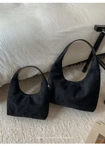Comparison of black matte faux suede hobo bags in large and small sizes with top zipper