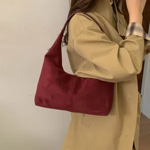 Minimalist burgundy suede dumpling shoulder bag with half-moon shape for women