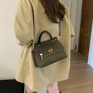 Elegant vintage frosted green handbag with gold twist lock and shoulder strap for women